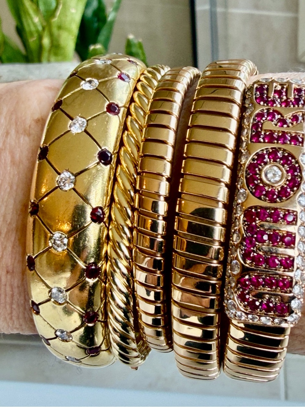 Sold.      18 karat diamond and Ruby quilted bangle